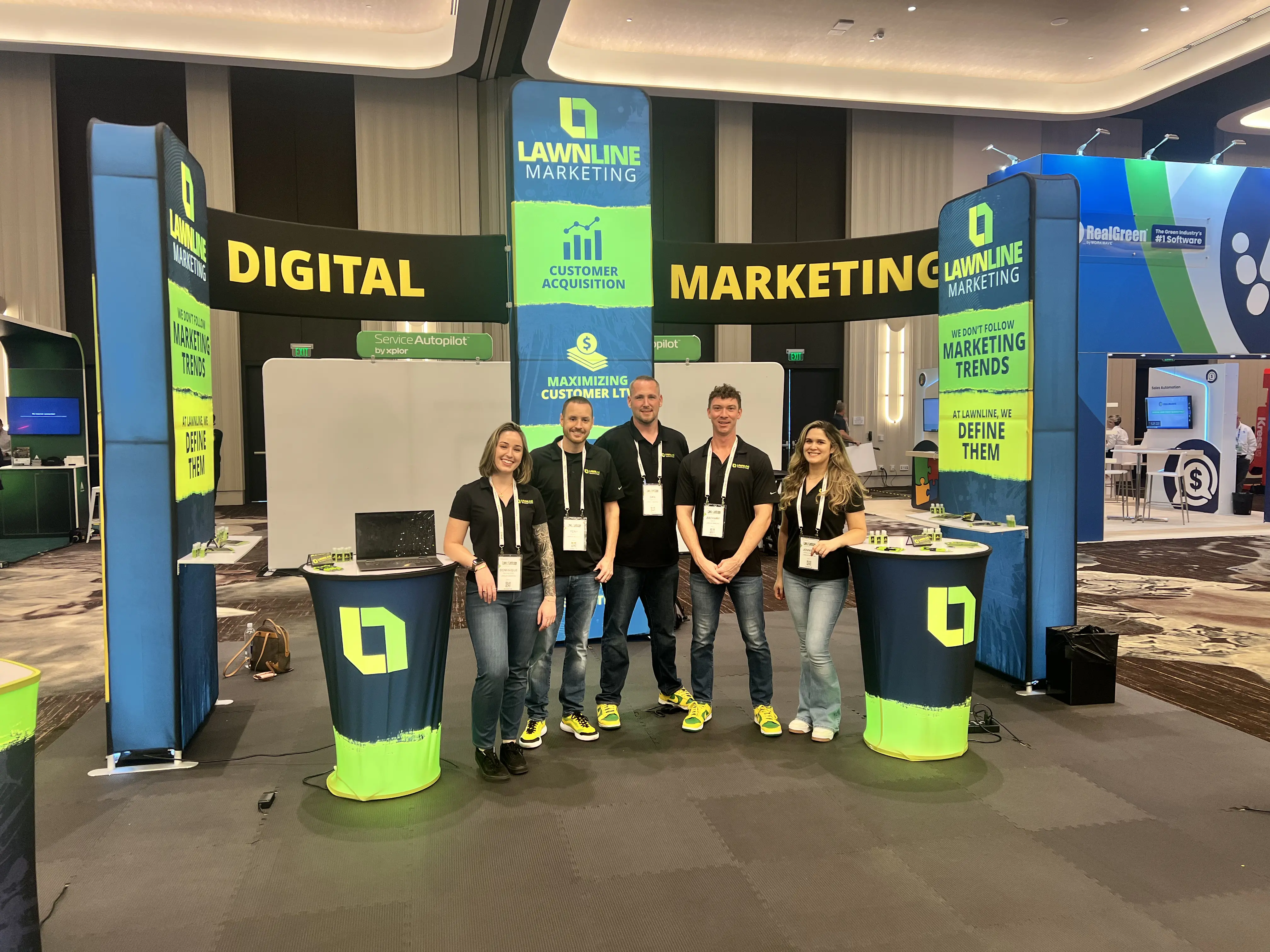 Lawnline Marketing team at trade show booth